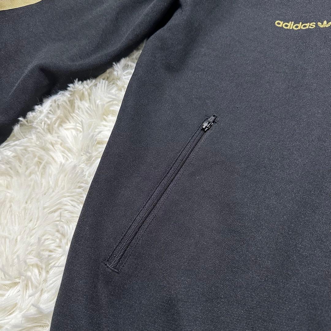 アディダス トレフォイル ロゴ刺繍 トラックジャケット ブラック 黒 金色