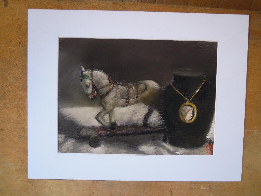 馬とペンダント