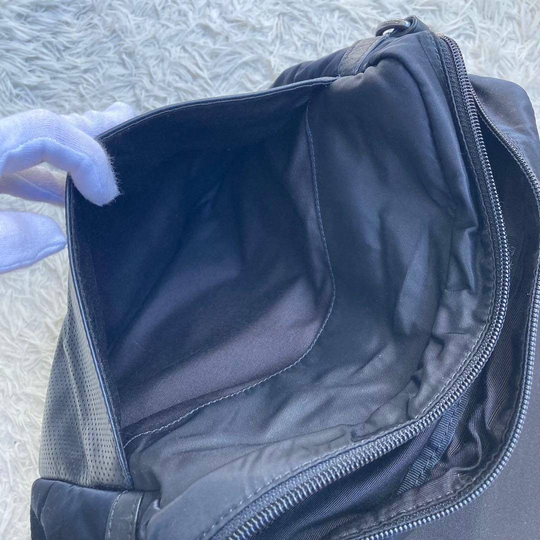 COACH フライトバッグ 黒 ブラック パンチング レザー 革 バックル