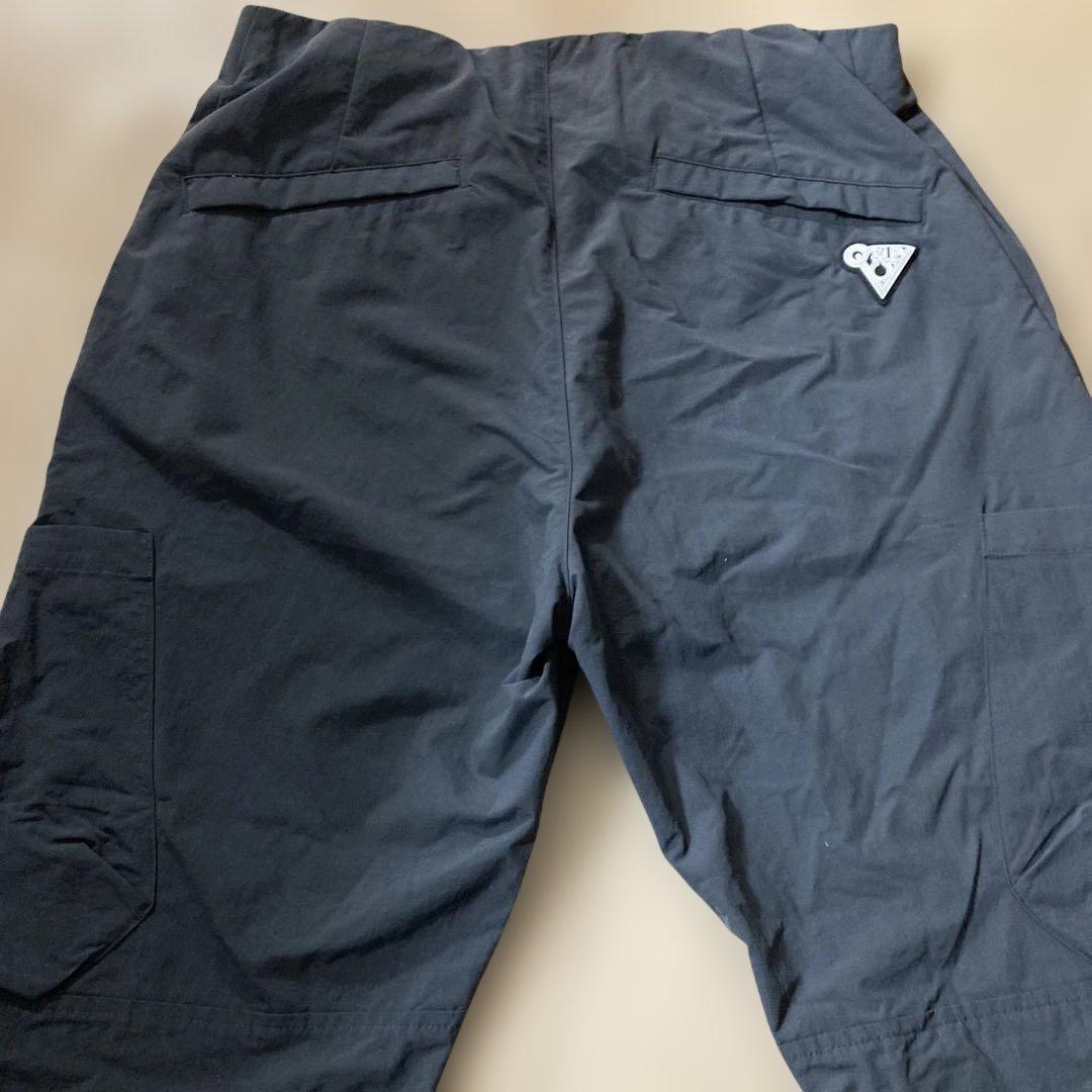 新品未使用タグ付きOAKLEYマットチャコールグレーピステウィンドブレーカーXL